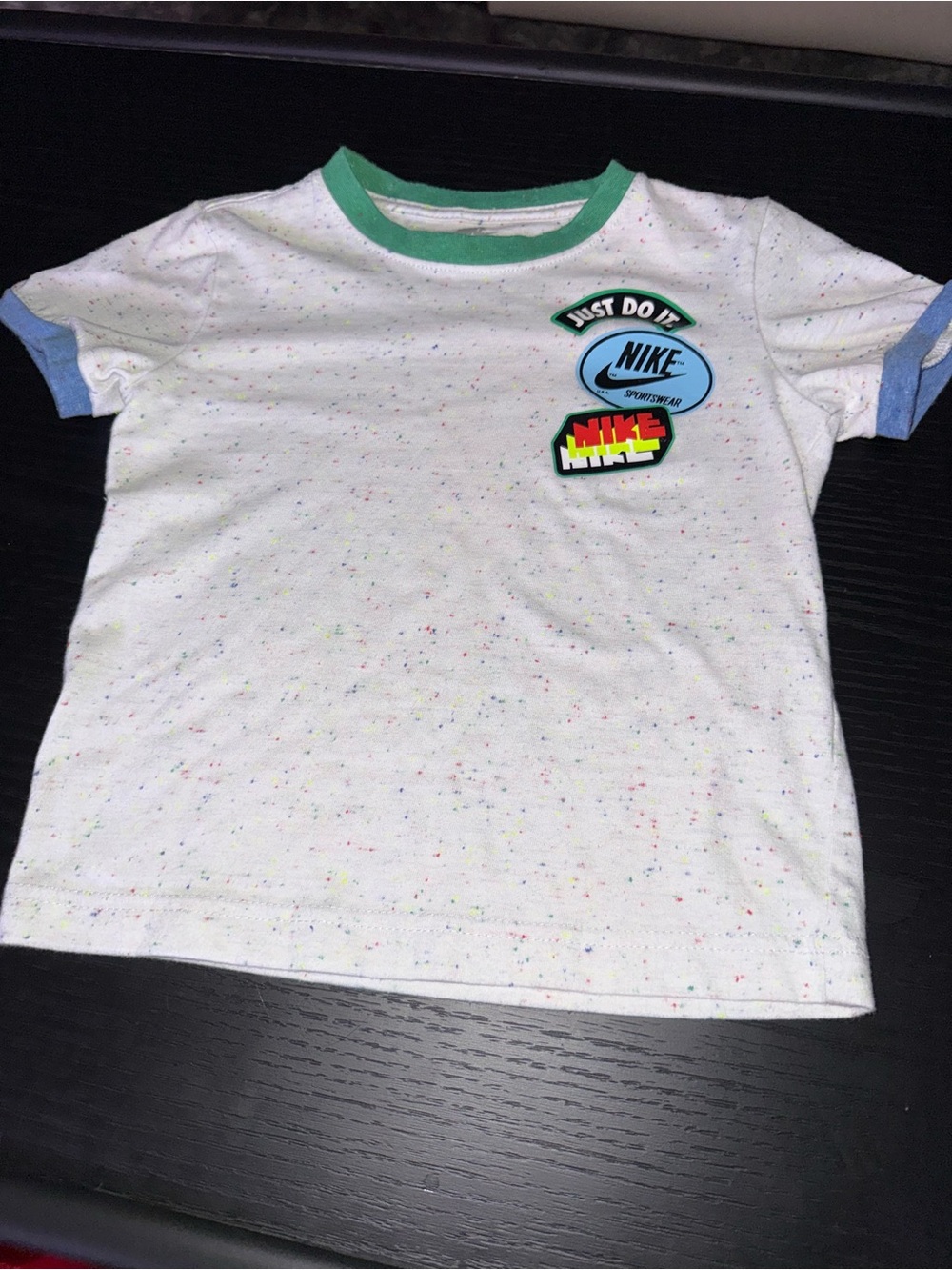 Nike Kids White Speckled Tee with Green Neck and Blue Cuffs